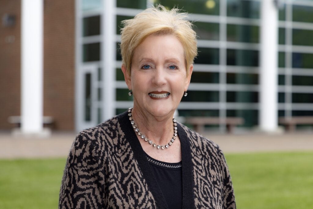 Dr. Barbara Fuller posing for photo on the campus of Southwest Virginia Community College.