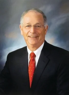 Dr. Ron Proffitt smiling for a professional headshot.