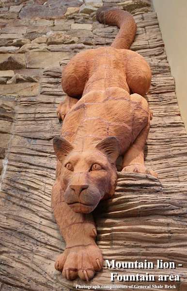 brick sculpture lion crouching