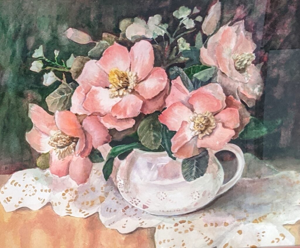 pink flowers in pot on table