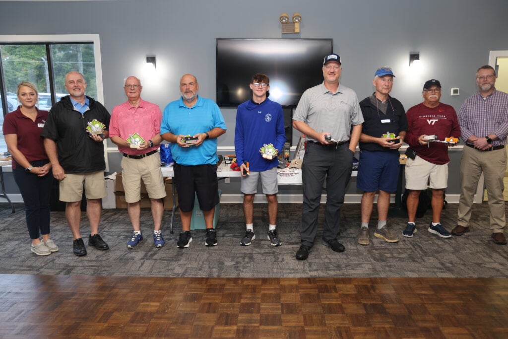 Picture of Flights 1-6 alongside Stacey McGhee and Dr. Clinton Hayes