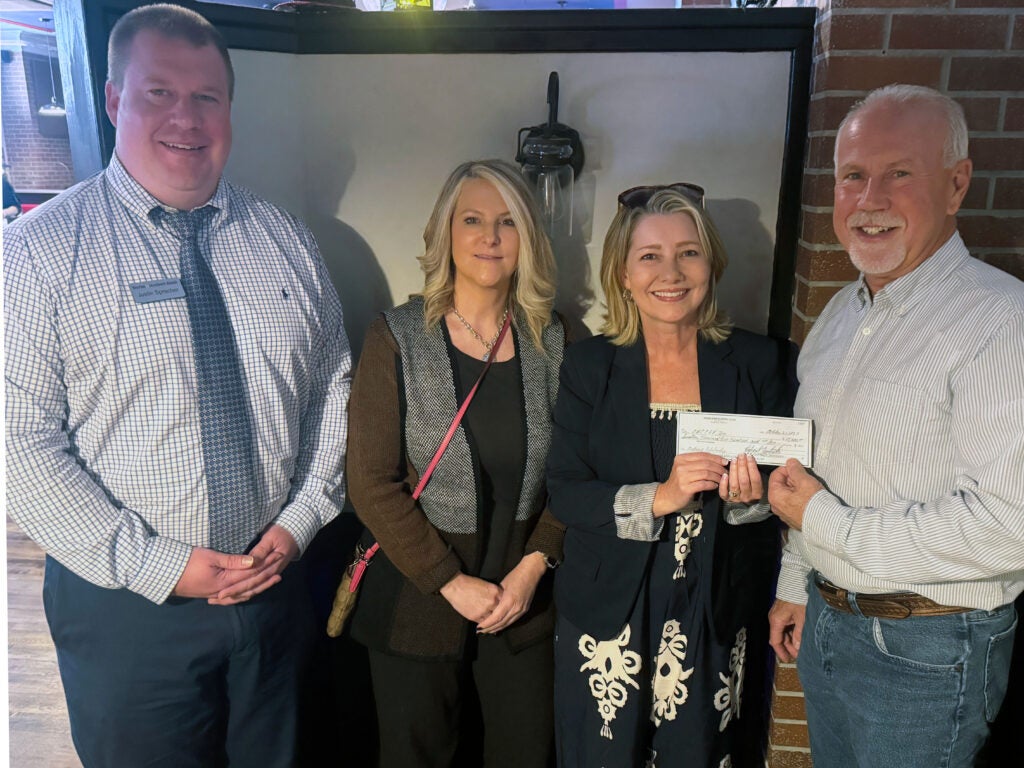 3 members of the Sales Executive Club of Bluefield standing alongside Susan Lowe of Southwest.