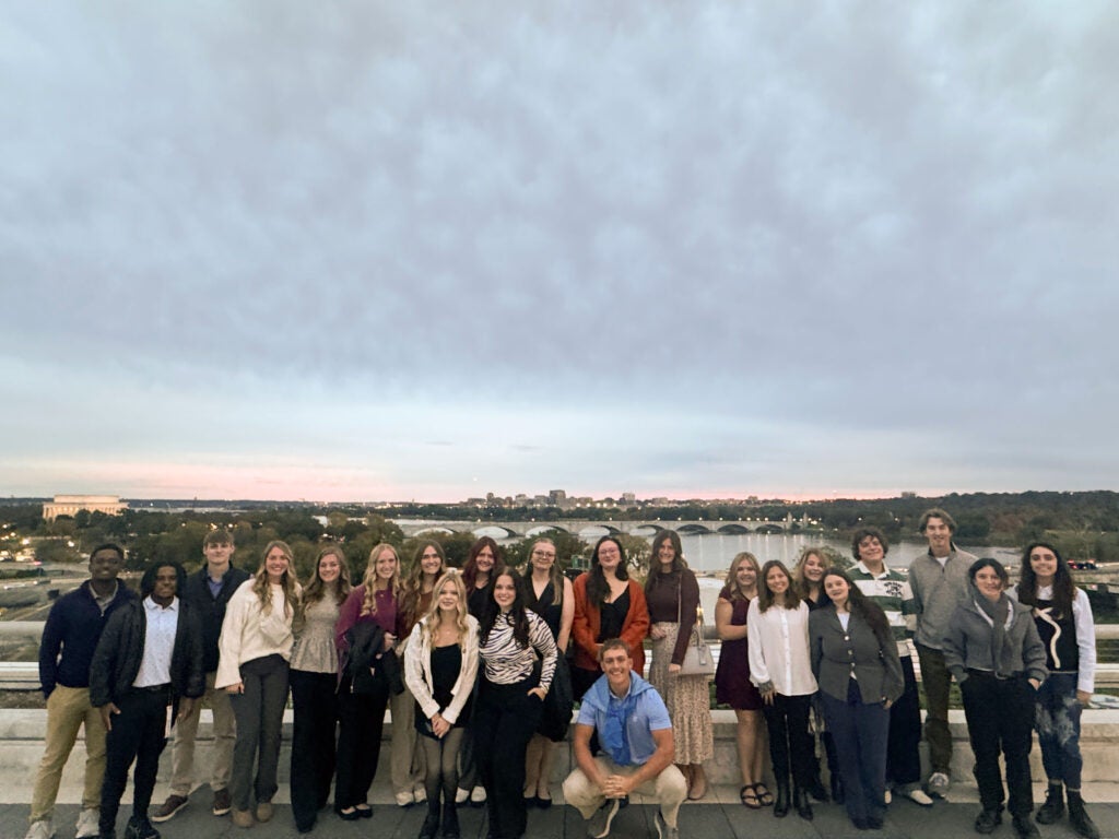A Group picture of the Southwest Honors group standing on a bridge.