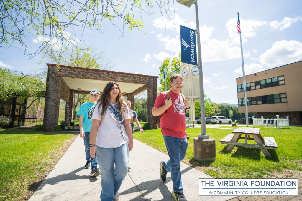 Student Walking on Campus with the VFCCE logo on the bottom