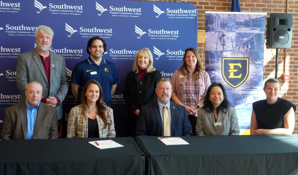 Group photo. Standing (L-R): Dr. Brian Wright, Dean of Arts and Sciences Brandon Pennington, Assistant Director of Transfer and Recruitment (2009 SWCC Alumni) Dr. Susie Mullins, Transfer Specialist Whitney Marlow, Director of Transfer and Adult Student Outreach. Seated (L-R): James Dye, Dean of Business, Engineering, and Industrial Technology Dr. Bethany Rose, Vice President of Academics and Student Services Dr. Bill Flora, Associate Provost for Curriculum Dr. Tao Huang, Chair of Art and Design Morgan Gilbert, Associate Professor and Chair of Fine Arts