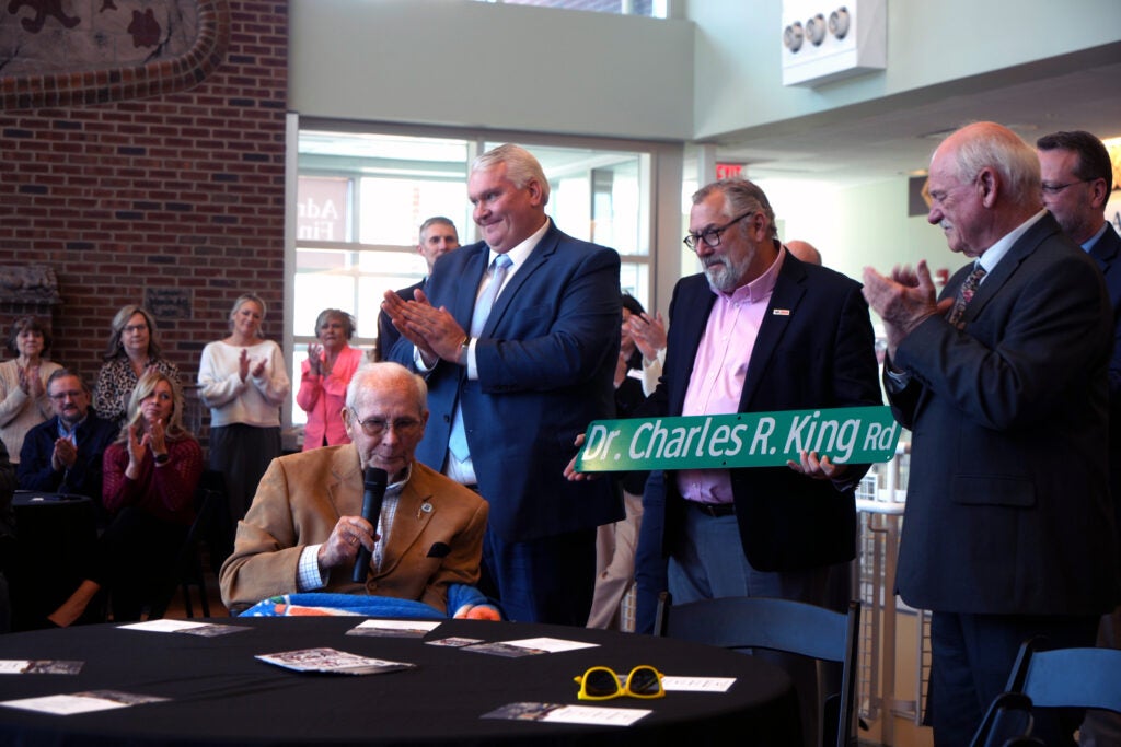 Dr. Charles R. King speaking alongside Representative Travis Hackworth, Tom Lester, Dr. Clint Hayes, and Curt Breeder