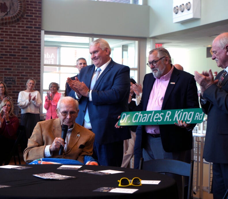 Dr. Charles R. King speaking alongside Representative Travis Hackworth, Tom Lester, Dr. Clint Hayes, and Curt Breeder