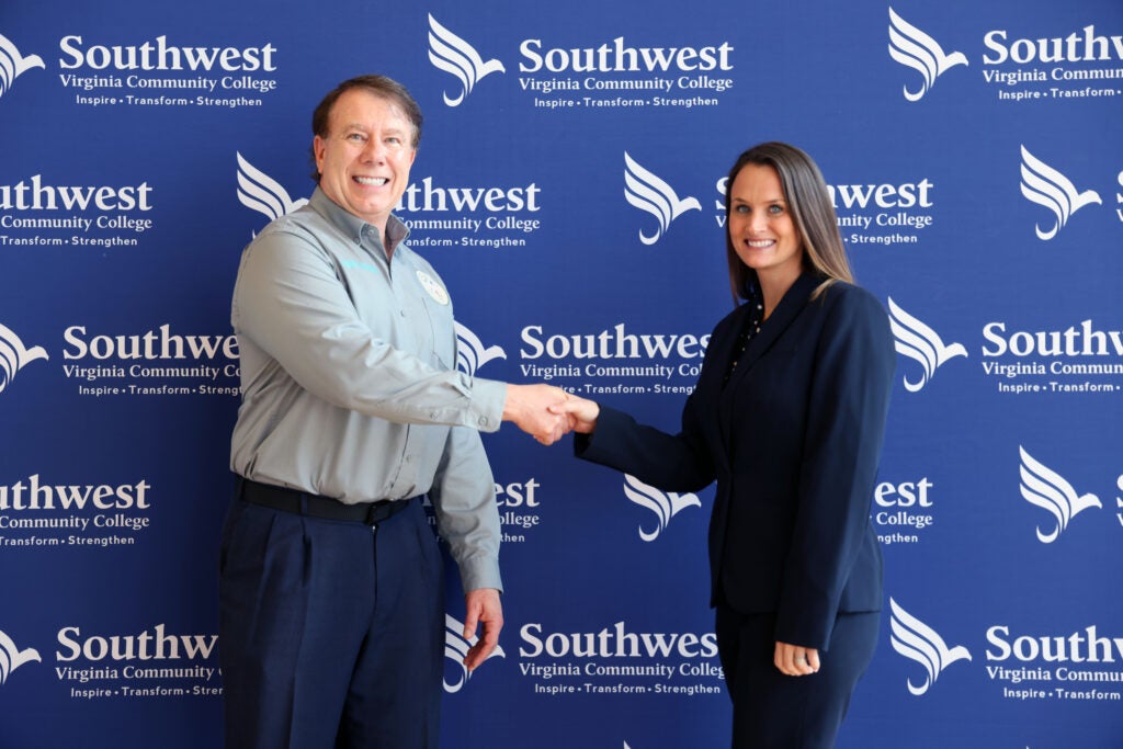 Jess Powers, Russell County Emergency Management and Hazmat Coordinator shaking hands with Dr. Bethany Rose, VP of Academic and Student Affairs