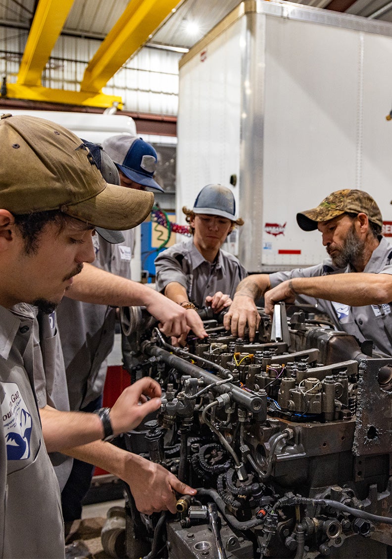 Group working on a diesel engine.